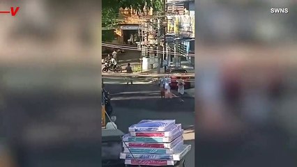 Watch Locals Escape a Wild Elephant in the Streets of India