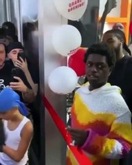Kodak Black cuts the ribbon at the opening of his Miami boutique