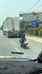 Truck's Unsecured Cargo Precariously Teeters