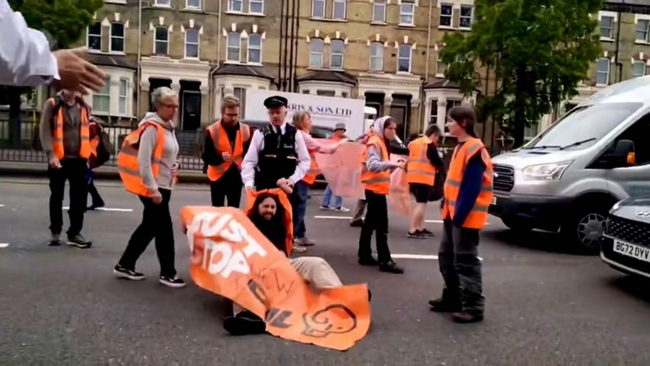 Watch: Police drag Just Stop Oil activist along road as group blocks traffic