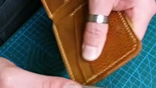 Burnishing the edges of a leather wallet for a glassy look - Leathercraft