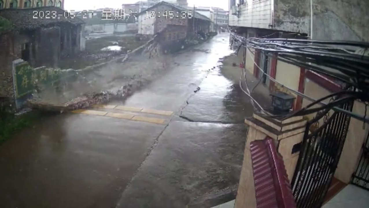 Brick wall collapses from monsoon winds seconds after cab passes by