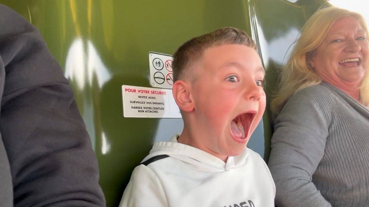 Little boy rides Toy Soldiers Parachute Drop in Disneyland Paris for the first time