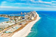 This City on Florida's Emerald Coast Has a New Hotel With 800 Feet of Gorgeous Beach, a Private Dock, and a Super-chic Pool