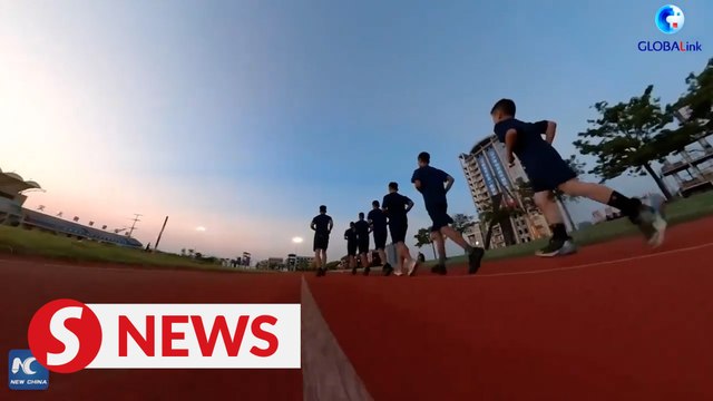 Primary school boy trains with firefighters in Guangxi