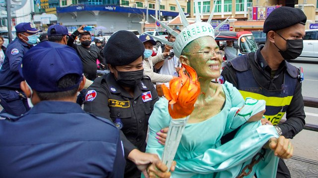 Cambodian court jails American lawyer, dozens of others on treason charge