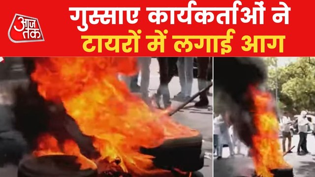Congress workers burn tyres outside ED office in protest
