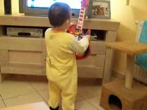 je joue de la guitare