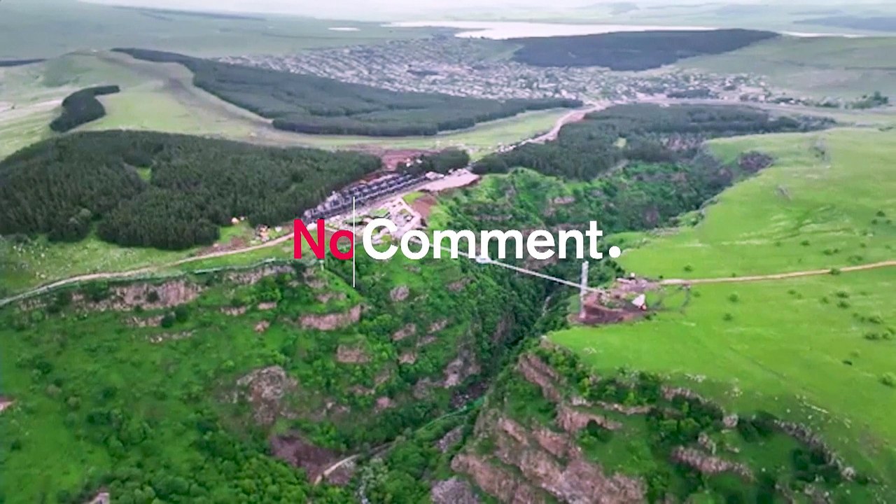 Tourists flock to 240-metre glass bridge across...