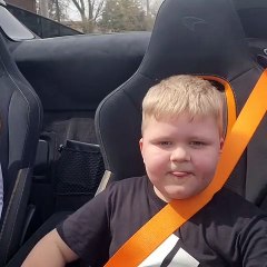 Kid both scared and thrilled after speedy car experience
