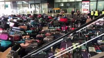 'Mar' de malas no terminal 2 do aeroporto de Heathrow após avaria