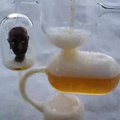 Person Shows Unique Beer Jug With Multiple Chambers and Tubes