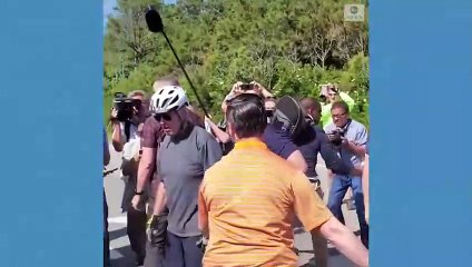 Biden falls off his bike