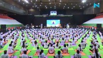 Arvind Kejriwal performs Yoga with hundreds of others at Delhi Stadium