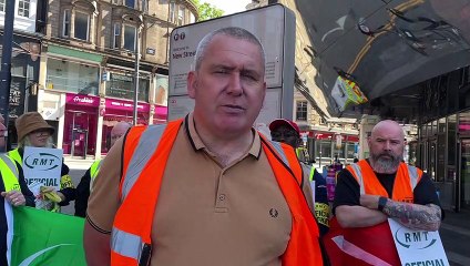 RMT members train explain why they are striking outside Birmingham New Street