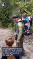 Bear Stalks Family Along Hiking Trail in Whistler