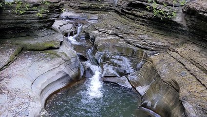 Tranquil water falling down creek