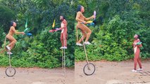 'Circus duo shows off their IMPECCABLE balancing skills with a ladder, unicycle & juggling pins '