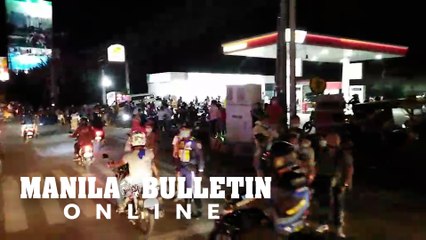 Davao City residents lined along the highway to see the homecoming of former President Rodrigo Duterte