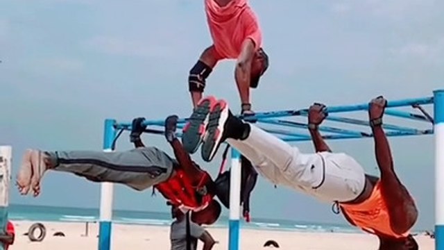 Trio Performs Amazing Calisthenic Moves at Beach