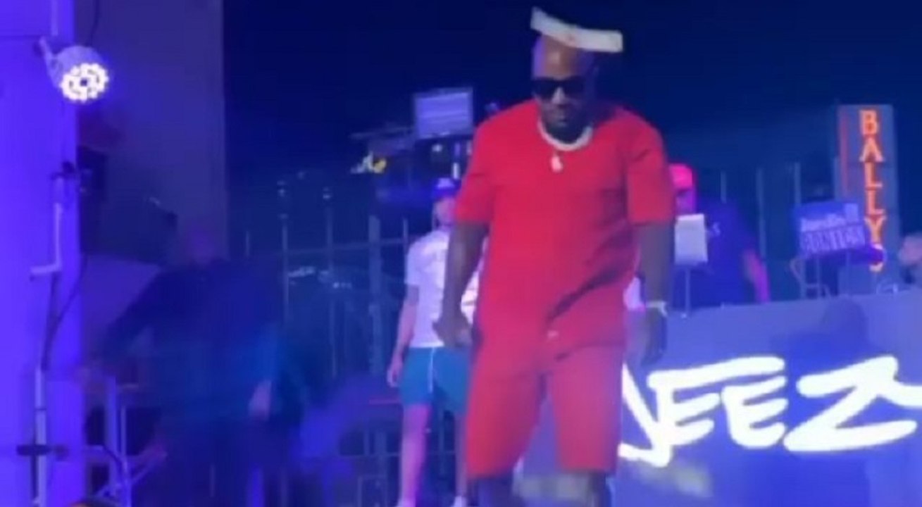 Jeezy gets mad at fans who make it rain money on him and he slaps it back at them