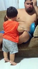 Toddler Knocks Popcorn Bowl Out of Dad's Hands