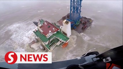 Video shows crew members being rescued from ship that snapped two in Typhoon Chaba