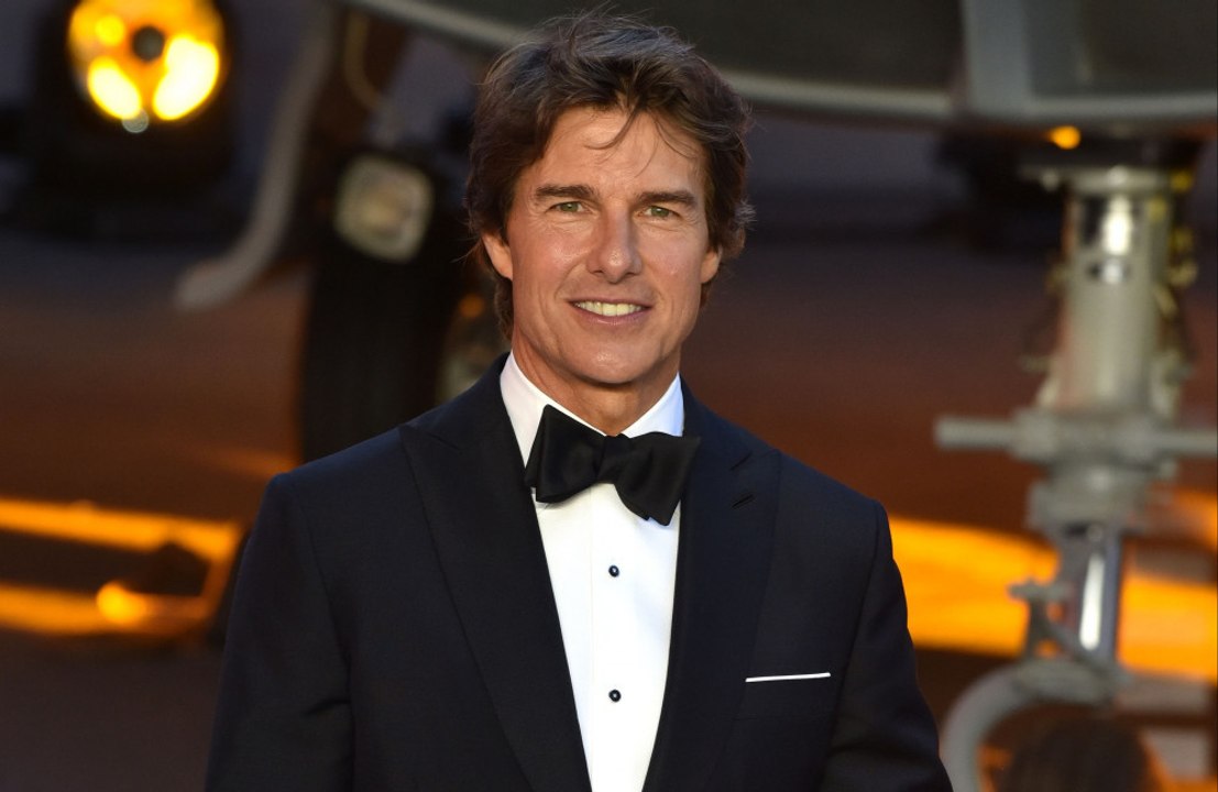 Tom Cruise kicked off 60th birthday singing and dancing to Adele with cake backstage