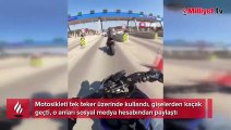 Otoyolda trafikte tek teker kullandığı motosikletiyle tehlike saçtı