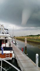 Tornado Drops on Docked Boats