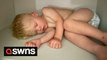 Meet the tot who will fall asleep anywhere but his own cot including in his wardrobe, on a shelf and even on his pet dog