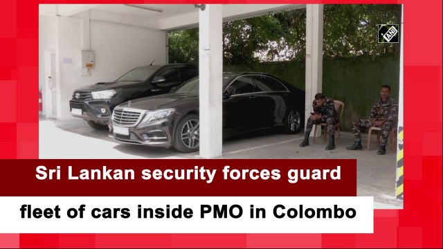 Sri Lankan security forces guard fleet of cars inside PMO in Colombo