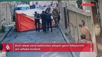 Evini ateşe verip balkondan atlayan genci itfaiyecinin ani refleksi kurtardı