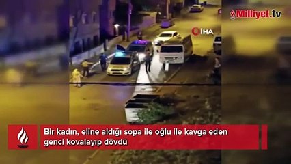 Anne, oğluyla kavga eden gence sopayla saldırdı