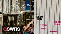 Extinction Rebellion activists smashed windows at the entrance to the News UK offices at London Bridge