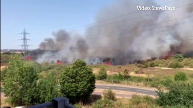 Huge fire erupts in field in London suburb of Dartford as UK hits record temperatures during heatwave