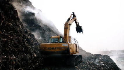 A mountain of garbage keeps catching on fire in Delhi — these people live next to it