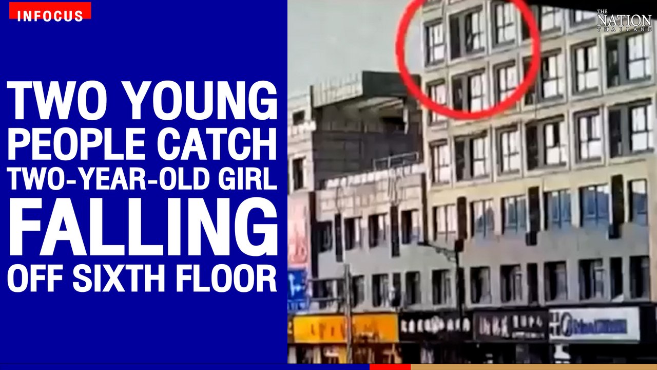 Two young people catch two-year-old girl fallin...