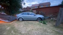 The aftermath in Easington Road, Hartlepool, after a car careered off the road into the back fence of house