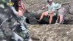 Men Teamed Up to Rescue Adorable Baby Elephant That Got Stuck in Hole
