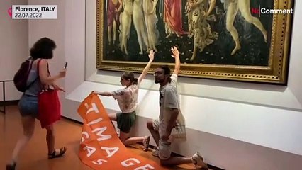 Download Video: Italian climate activists glue their hands to a Botticelli painting