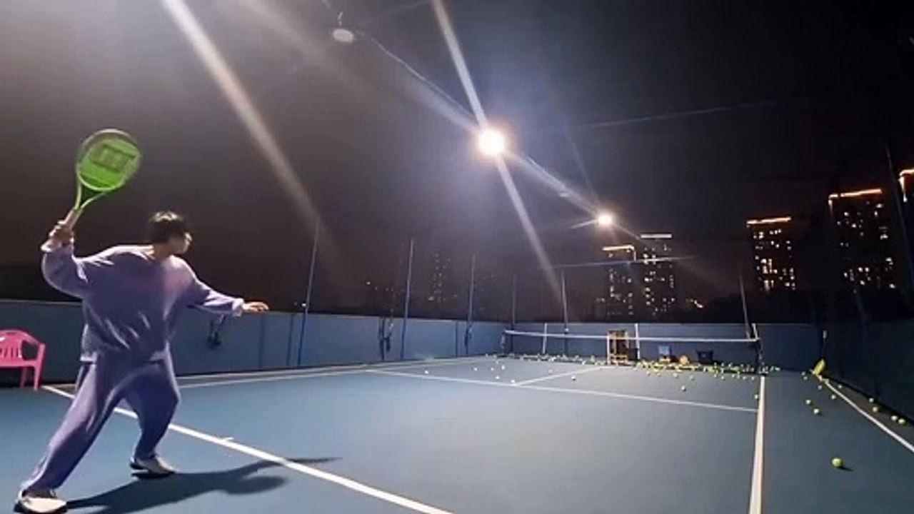 Jin Playing Tennis