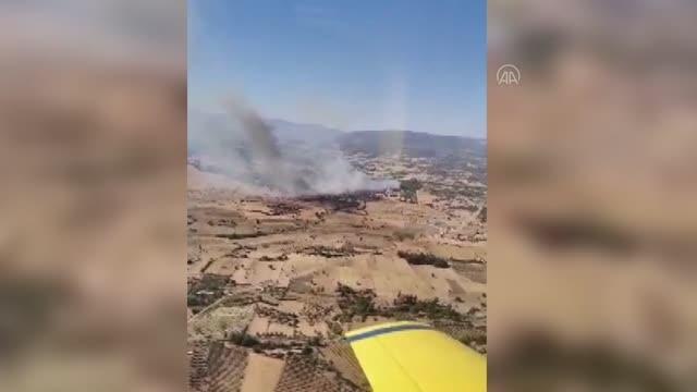 Milas'ta orman ve makilik alanda çıkan yangına müdahale ediliyor