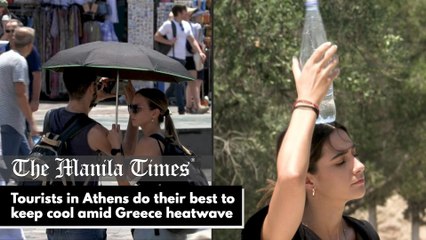 Tourists in Athens do their best to keep cool amid Greece heatwave