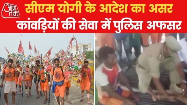 UP Police officers engrossed in the service of Kanwariyas