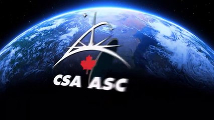 While sitting on the end of Canadarm2, Dextre is lowered into Dragon's external compartment