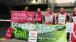 Striking rail workers picket outside London Euston