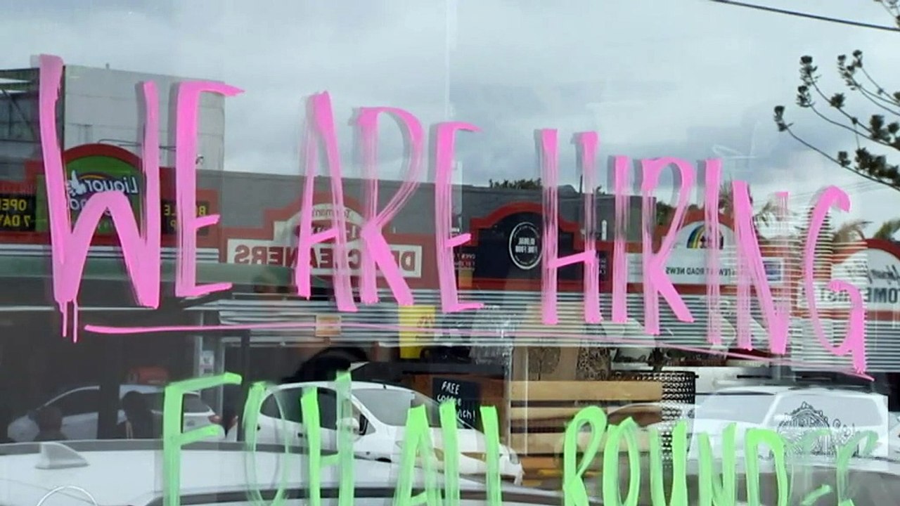 A Brisbane barbershop is flying in workers from interstate because it can't find staff.