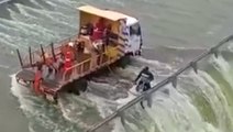 Motorcyclist rescued from flooded bridge in India
