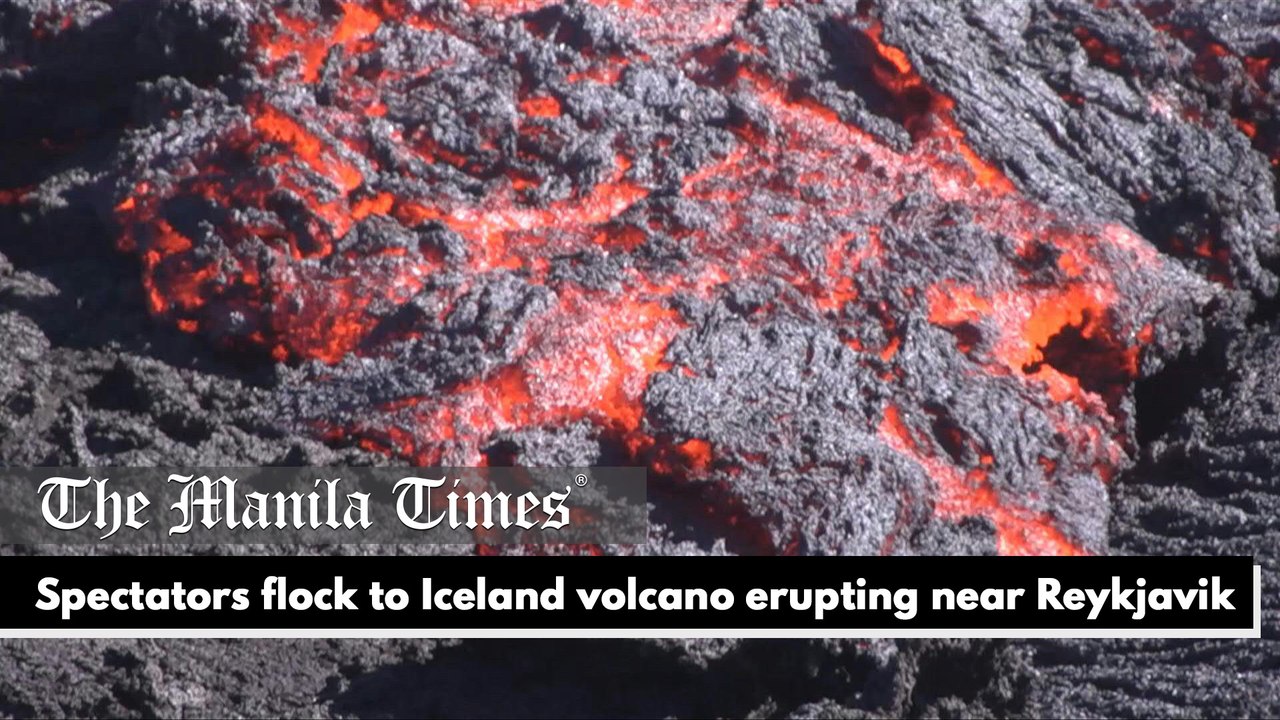 Spectators flock to Iceland volcano erupting ne...